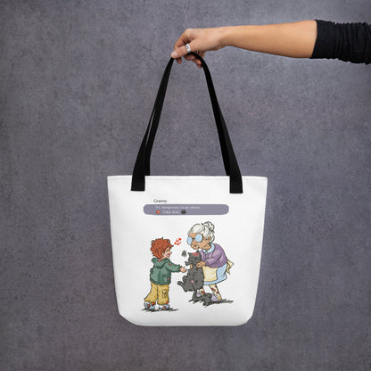 Totebag with the illustration of a granny passing a grumpy cat to her way-to-happy grand-son. The discussion goes like "It's dangerous to go alone, Take this!" referring to the Zelda game. The bag is white and has black handles.