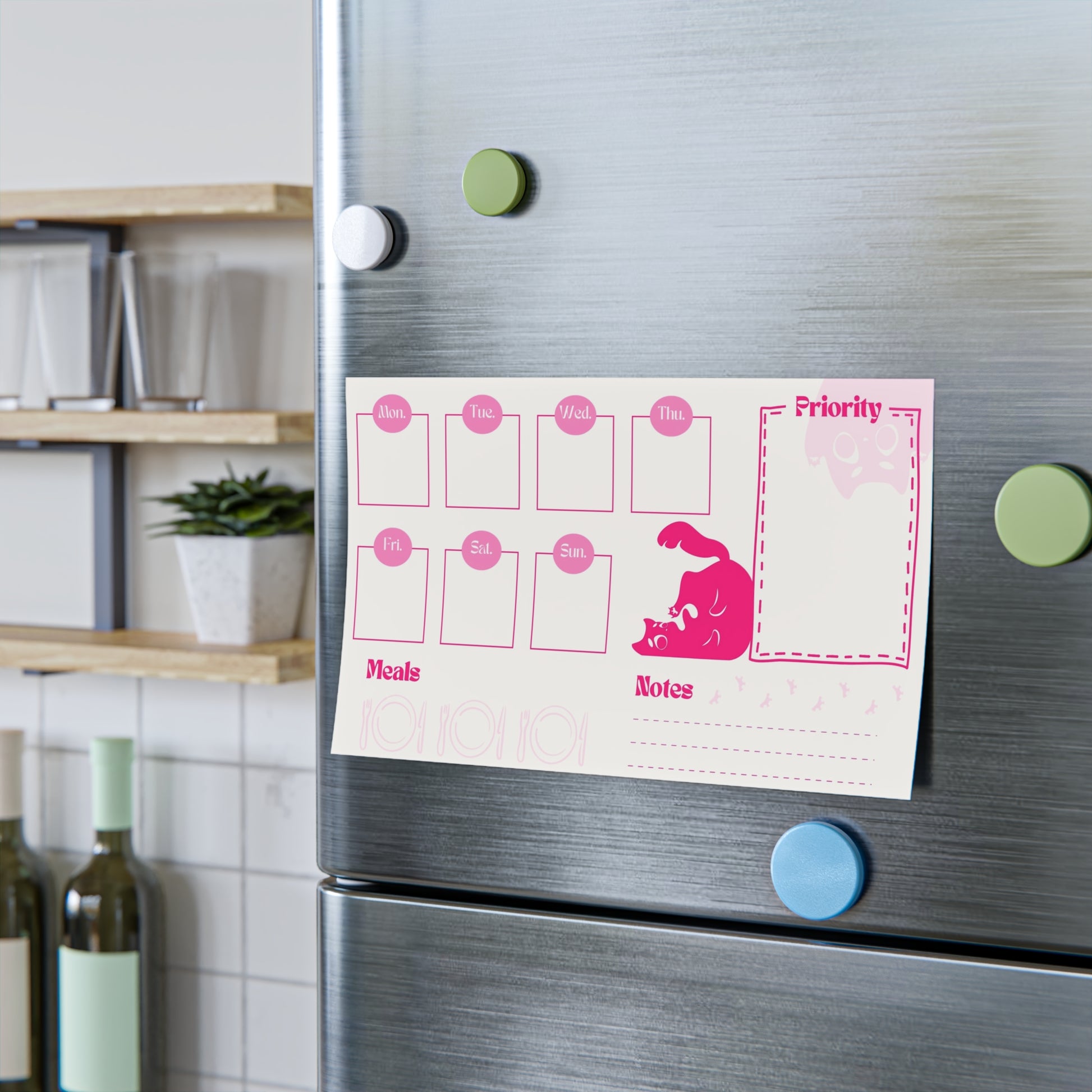 Pink Planner of Squeekat on the fridge door, perfect to jot down your grocery list, priority list, notes, weekly calendar and meals prep.