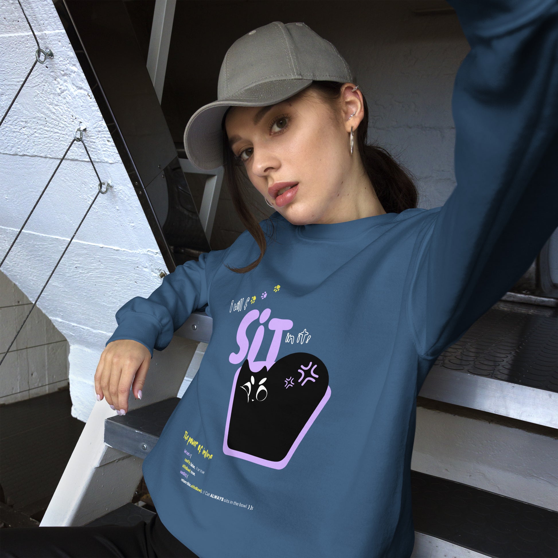 Woman wearing an indigo blue crew neck sweatshirt featuring a black cat sitting in a tiny bowl. The title "I will f*** SIT in it!". Funny pun about cats being persistent in trying to fit in any space possible, and the JavaScript command.
Perfect gift for your nerdy friends and cat lovers!