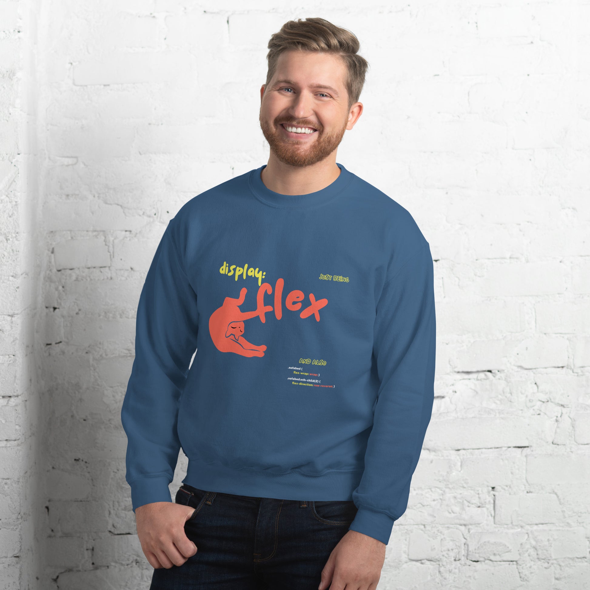 Man wearing an indigo blue crew neck sweatshirt featuring a stretching cat with the title "Just bein' Display: flex". Funny pun about cat being flexible and the css command.
