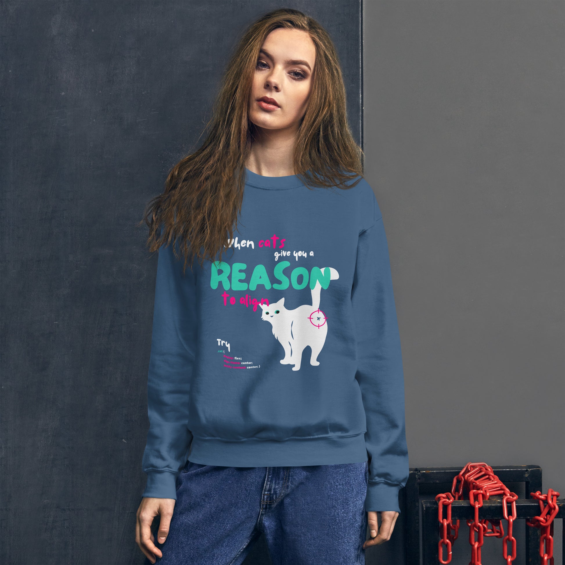 Woman wearing a crew Neck sweatshirt in indigo blue color, for cat lovers and nerd developers, featuring a cat showing his butt, with the inscription "When cats give you a reason to align" and some line codes.