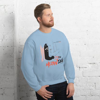 Man wearing a light blue crew neck sweatshirt with illustration of a cat trying to break into a door. Parody of the Shining, this design is called "The Meowing & scratching" because you never know when he's gonna strike. This version shows a mischievous cat scratching the floor in an attempt to enter the room.