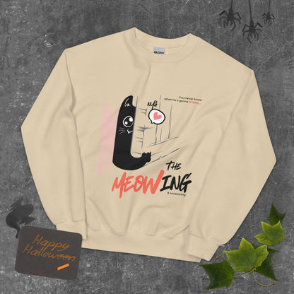 Sand crew neck sweatshirt with illustration of a cat trying to break into a door. Parody of the Shining, this design is called "The Meowing & scratching" because you never know when he's gonna strike. This version shows a cute cat showing the finger while trying to enter the room.