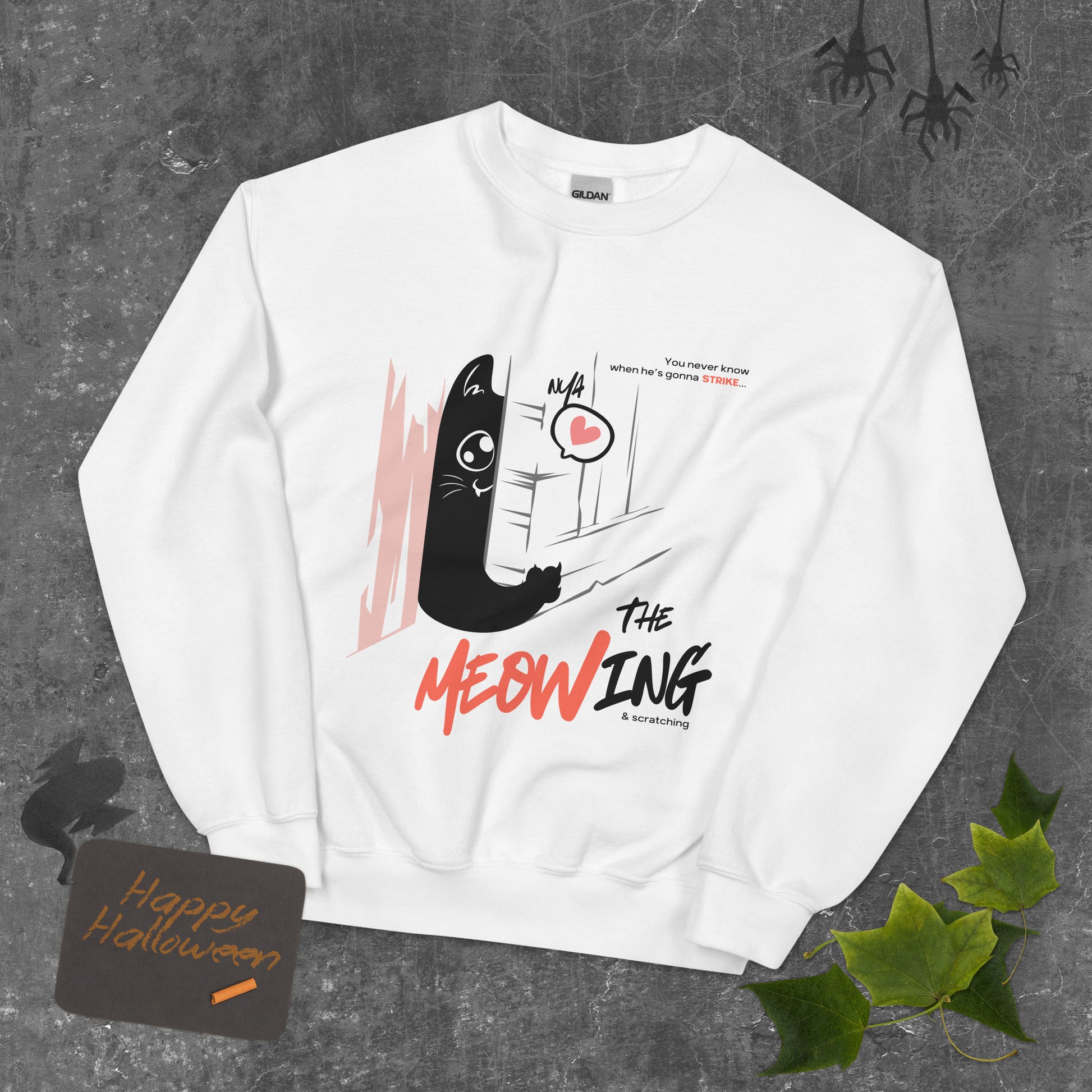 White crew neck sweatshirt with illustration of a cat trying to break into a door. Parody of the Shining, this design is called "The Meowing & scratching" because you never know when he's gonna strike. This version shows a cute cat showing the finger while trying to enter the room.