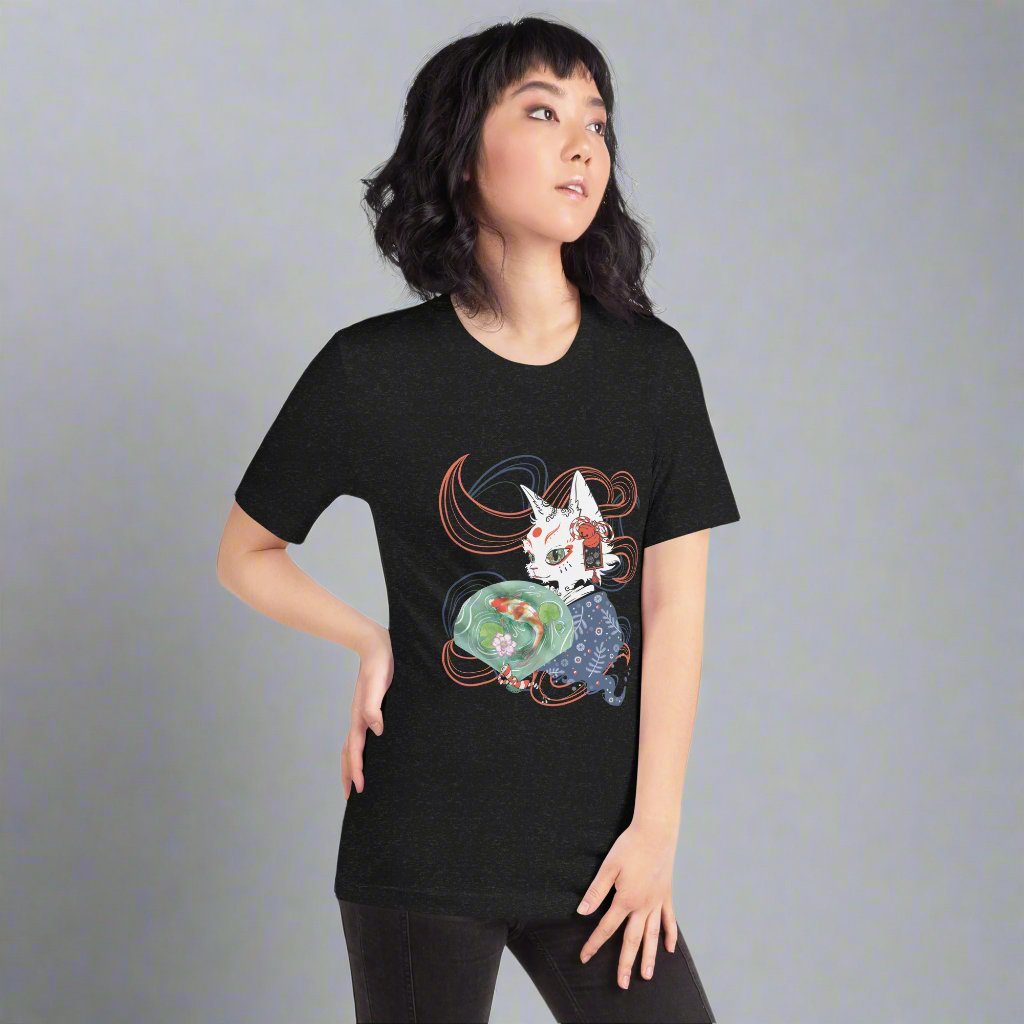 Woman wearing a black T-shirt with a digital illustration of a folklore Japanese cat monster Bakeneko, dressed in a blue patterned kimono. The fan its holding has a koi fish swimming in a pond. Colored waves are displayed on the dark background.